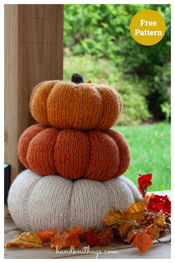 three knit pumpkins stacked on top of each other