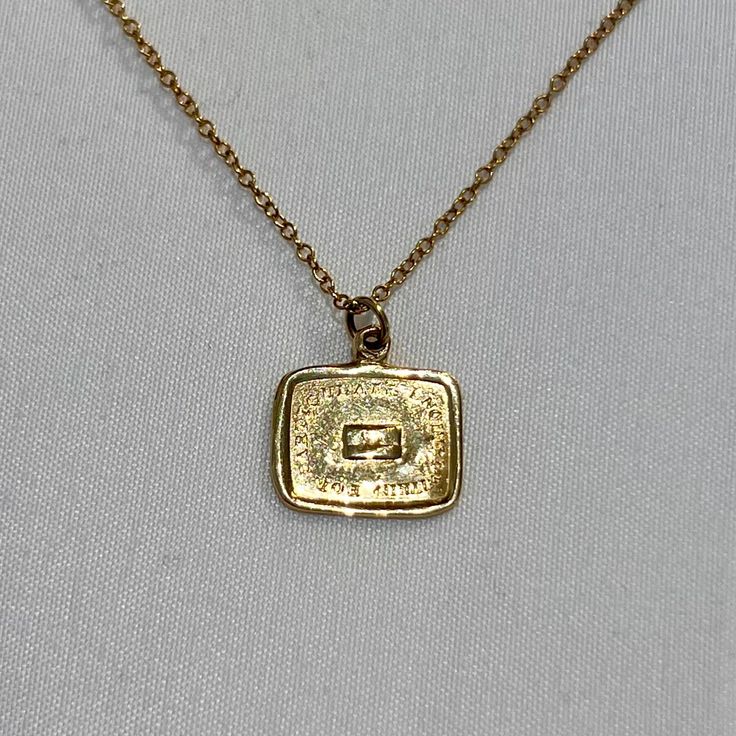 "A charming handmade necklace in 14k gold cast from an impression of a Victorian wax seal. The phrase \"for particulars inquire within\" surrounds a tiny envelope with a heart. Charm has been given an antique finish to enhance the inscription. Soldered ring at top threaded through a delicate 14k gold chain." Classic Gold Charm Necklace With Square Pendant, Vintage Recycled Gold Jewelry As A Gift, Vintage Recycled Gold Jewelry Gift, Vintage Necklace With Rectangular Pendant For Anniversary, Vintage Necklaces With Rectangular Pendant For Anniversary, Classic Gold Necklace With Square Pendant, Classic Gold Rectangular Charm Necklace, Classic Stamped Gold Jewelry, Vintage Yellow Gold Necklace With Rectangular Pendant