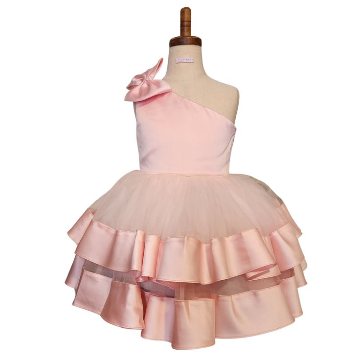 This dress can be worn for any special occasion like weddings, pageants, birthday parties, holiday parties (Christmas or New Years), Father/Daughter Dances, kid's proms, etc Features: Bowknot On One Shoulder Multi-layer Ruffles Satin and Tulle V Back Knee Length Use a crinoline to make the dress stand out Care: Light Iron or Steam to knock out wrinkles; Dry Clean or Spot Clean Pair with our champagne kitten heels to make this dress all the more festive! Girls Holiday Dresses, Dress Stand, Father Daughter Dance, Holiday Dress, Father Daughter, Holiday Dresses, Holiday Parties, Soft Pink, Birthday Parties