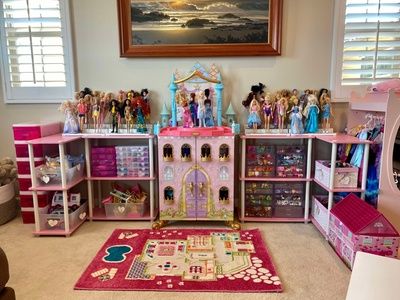 a room filled with lots of dolls and toys