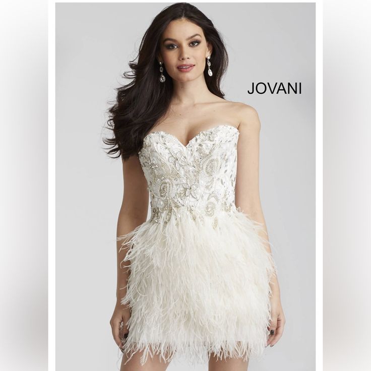 Jovani Ivory Strapless Feather Short Sexy Wedding Cocktail Dress 50122 Size 2 Back Zipper Closure Elegant Lovely , Intricate Beading Worn Once For A Few Hours Wedding Dress Msrp $640 Make Me An Offer ! Wedding Dress With Feather Trim And Fitted Bodice, Wedding Evening Dress With Feather Trim And Fitted Bodice, Strapless Wedding Dress With Feather Trim, Strapless Feather Trim Wedding Dress, Elegant Wedding Evening Dress With Feather Trim, Glamorous White Feathered Dresses, White Sweetheart Neckline Evening Dress For Prom, White Evening Dress With Sweetheart Neckline For Prom, Elegant White Feathered Dress