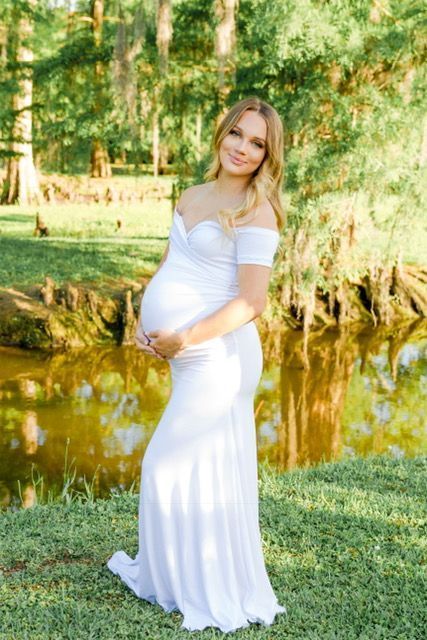 Summer maternity shoot! This white Short-Sleeve Off the Shoulder Sweetheart Maternity Gown is the perfect photoshoot, baby shower, or special event. With a cross over sweetheart bust, a slim fit bodice, a simple flare, and ultra-soft, stretch material this gown is equal parts comfort and elegance.  #maternitygown #maternityphotos #photoshoot #whitegown #summerphotos #summer #prettymama #momtobe #pregnant Maternity Fitted Gown With Sweetheart Neckline, Maternity Gown With Sweetheart Neckline, Fitted Maternity Gown With Sweetheart Neckline, Elegant Maternity Dress With Sweetheart Neckline, Maternity Fitted Dress With Sweetheart Neckline, Fitted Maternity Dress With Sweetheart Neckline, Maternity Dress With Sweetheart Neckline And Fitted Bodice, Fitted Bodice Maternity Dress, Fitted Off-shoulder Maternity Dress For Wedding