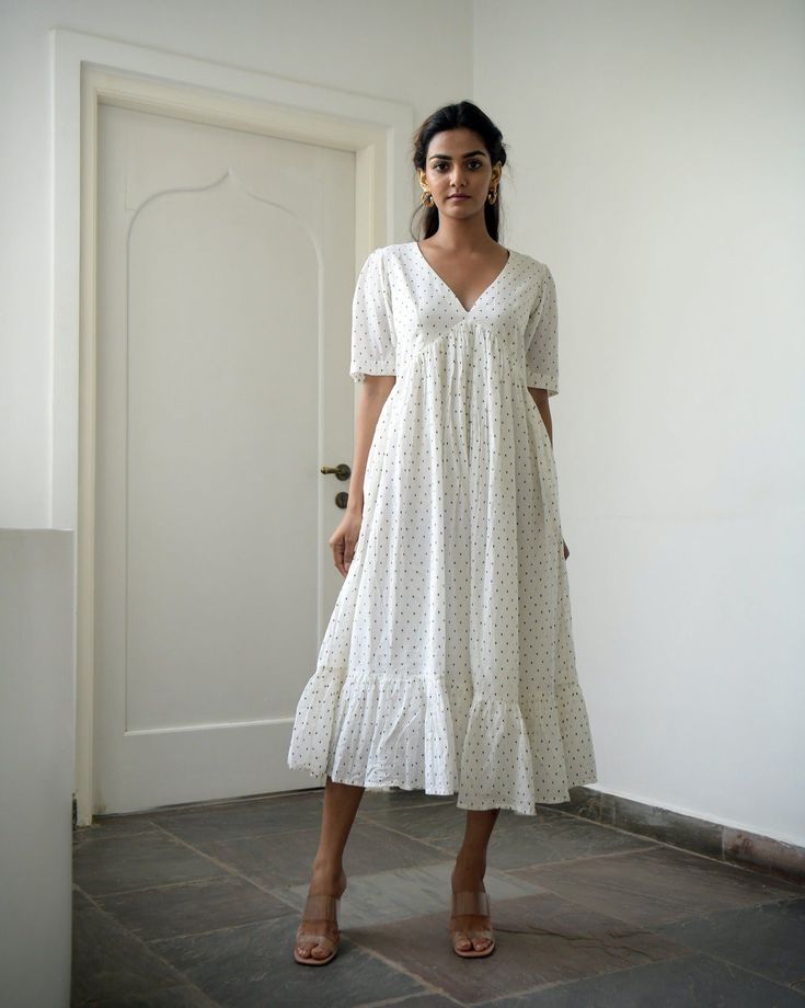 White Cotton Midi Dress at Kamakhyaa by Taro. This item is Best Selling, Evening Wear, FB ADS JUNE, Handwoven cotton, Indo-Western, July Sale, July Sale 2023, Kurtas, Midi Dresses, Natural, Prints, Regular Fit, Tiered Dresses, White, Wildflower Taro, Womenswear Frock Designs For Women, Cotton Dress Pattern, Simple Frock Design, Simple Frocks, Casual Frocks, Frock Patterns, Frock For Women, Trendy Dress Outfits, Printed Cotton Dress