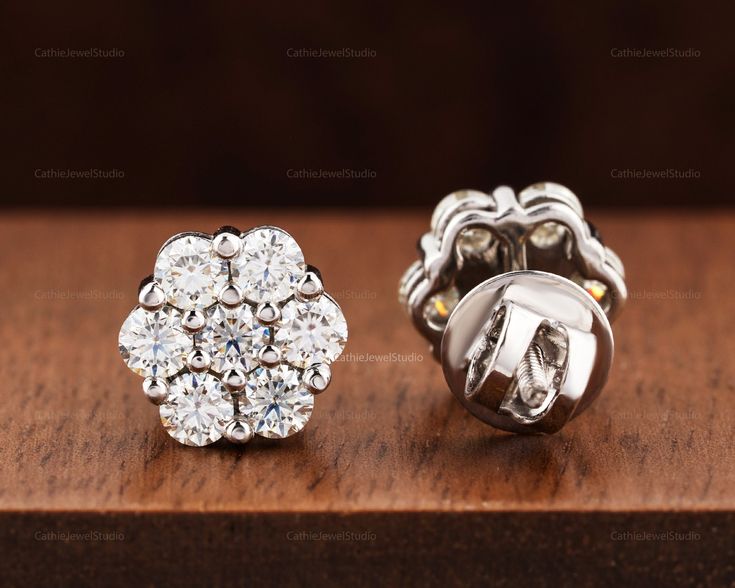 Celebrate love with our stunning flower cluster bridal Moissanite stud earrings, the perfect gift for a bride. Featuring a captivating cluster of Moissanite stones arranged in a floral design, these earrings are a symbol of everlasting love and devotion. Crafted with care and attention to detail, they make a meaningful and unforgettable gift for a special occasion. Order now and make the bride's day even more magical! ♦ NOTE: If you want PUSHBACK on earrings, please write them in the note when y Wedding Halo Setting Cluster Earrings, Anniversary Halo Cluster Earrings, Halo Design Cluster Earrings For Anniversary, Wedding Diamond Cluster Earrings With Halo Setting, Wedding Cluster Earrings With Diamond Halo Setting, Anniversary Cluster Earrings With Halo Setting, Wedding Cluster Diamond Earrings With Halo Design, Cluster Diamond Earrings With Halo Design For Wedding, Round Cut Cluster Earrings With Prong Setting For Wedding