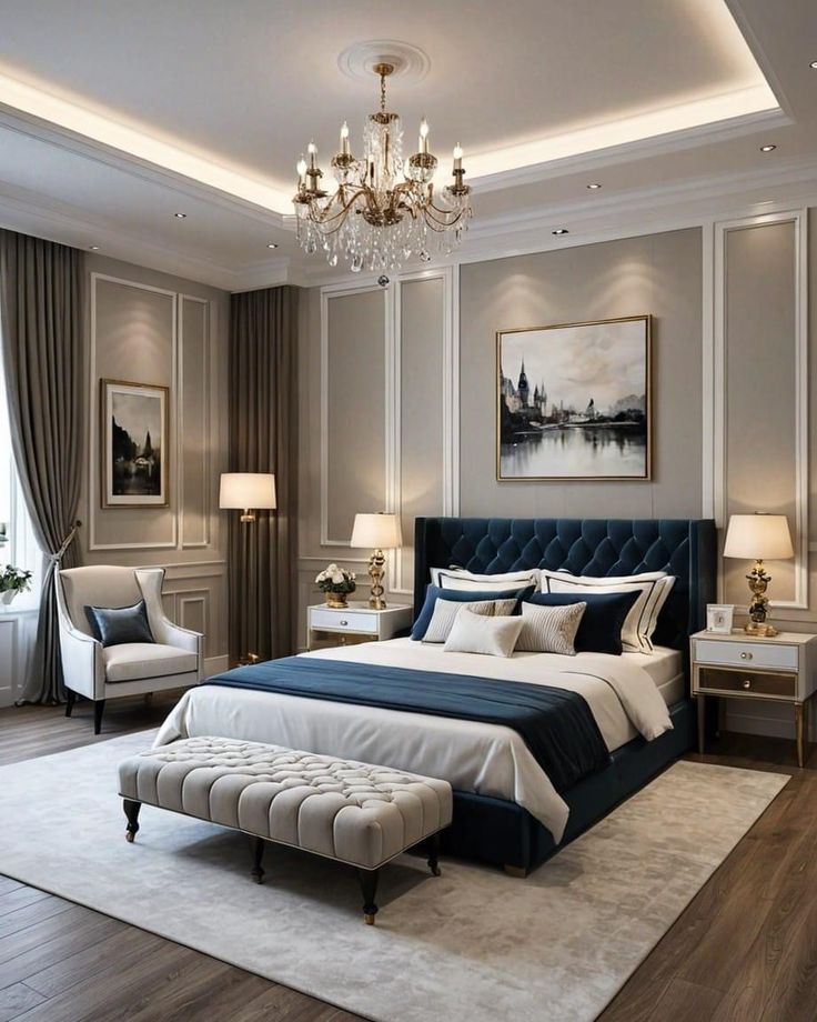 a bedroom with a large bed and chandelier