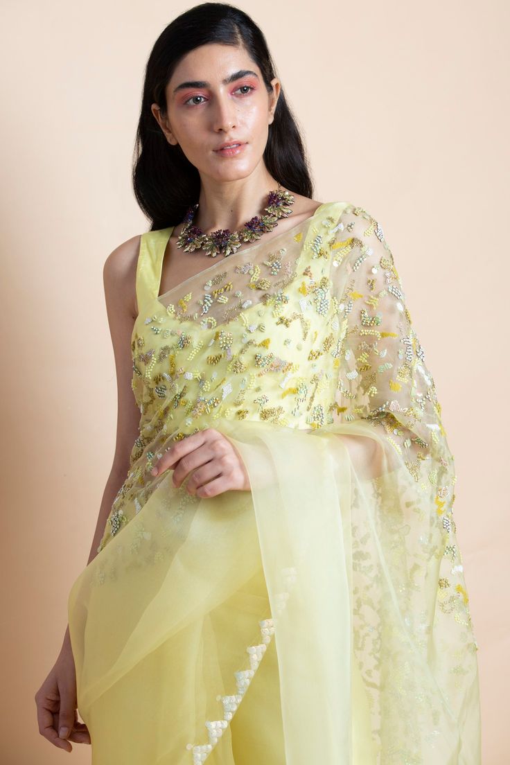 Editor's Note Featuring a lime yellow hand-embroidered silk organza saree. This comes with a matching blouse piece in chanderi and matching underskirt fabric in shantoon. Color: Yellow Fabric: Silk Organza Length: Saree Length: 5.5m; Blouse Fabric: 1m Care: Dry Clean Only About the Designer Saksham & Neharicka make modernizing Indian wear with rich handwoven textiles, fresh intricate textures, chic and classic silhouettes, Saksham & Neharicka handcraft all designs to eternal perfection. Their so Lime Yellow, Saree For Women, Yellow Saree, Yellow Silk, Hand Woven Textiles, Organza Saree, Silk Organza, Yellow Fabric, Fabric Silk