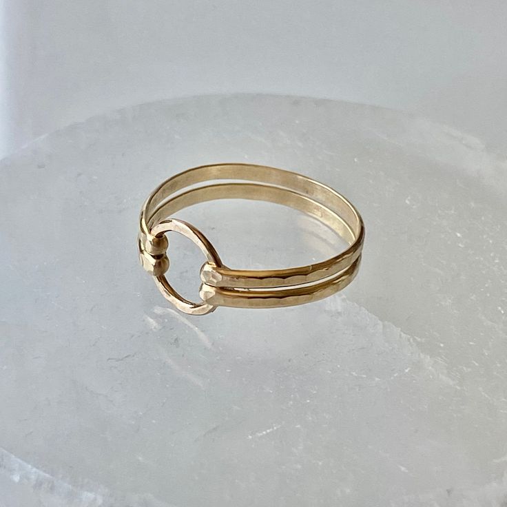 Two bands of heavy 14 gauge wire was hammered and forged to a 8mm gold filled circle. This double band ring is both delicate and bold. Select from gold band as shown, bright sterling silver, or mixed metal. Choose from sizes 4-10. Try stacking these with the other rings. View the rest of the ring collection below: http://www.etsy.com/shop/BellatrinaJewelry?section_id=11006644 ** Follow us for updates, contests, and promos. :) www.facebook.com/BellatrinaJewels www.twitter.com/BellatrinaJewel Gold Circle Ring, Double Band Ring, Stackable Rings Wedding, Double Band Rings, Gold Rings Stackable, Gold Circle, Ring Collection, Circle Ring, Gold Filled Ring