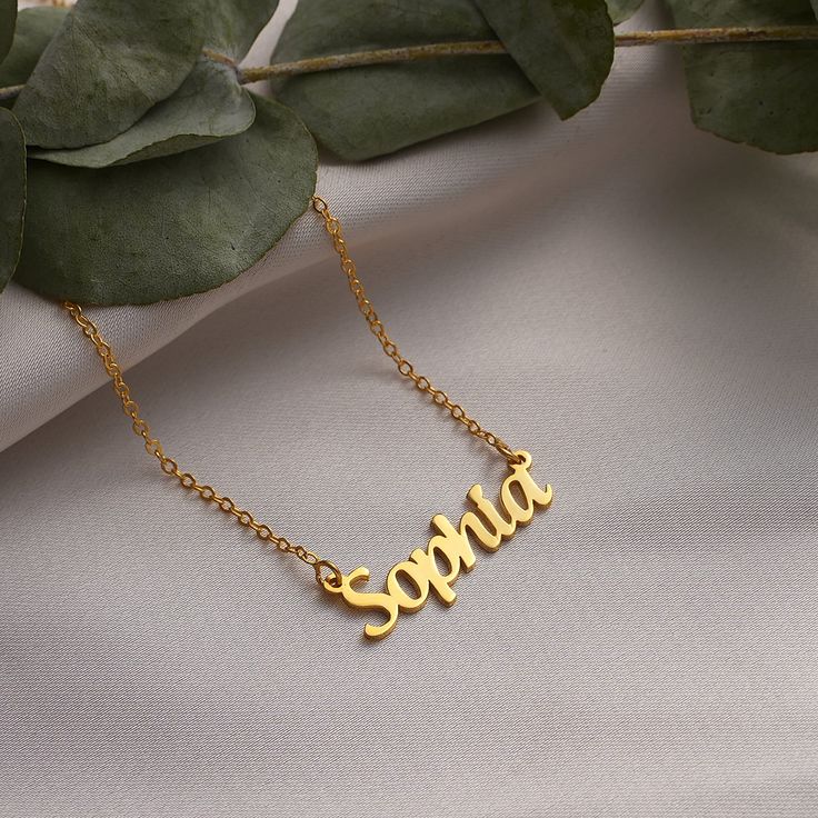 Welcome to MeiraGoldJewelry, where we create exquisite name necklaces to commemorate life's most precious moments. Our personalized name necklaces are the perfect choice for adorning your neck on occasions such as Christmas 🎄, New Year 🎉, Valentine's Day 💖, Mother's Day 🌹, Women's Day, Thanksgiving, Anniversaries 🥂, Weddings 💍, Birthdays 🎂, and more. These pieces are meticulously crafted to bring an elegant touch to your celebrations, transforming them into unforgettable memories that wil Customizable Nameplate Necklace For Personalized Gift, Customizable Pendant Name Necklace For Personalized Gift, Personalized Pendant Necklace For Gifts, Minimalist Customizable Necklace As Personalized Gift, Personalized Name Pendant Necklace As Gift, Custom Name Pendant Necklace As Personalized Gift, Personalized Pendant Necklace With Custom Name, Personalized Custom Name Pendant Necklace, Customizable Round Pendant Necklace As A Gift For Her