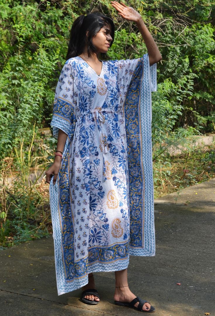 This Beautiful Hand Block Print Caftan or can be called as Tunic is made with super fine quality cotton and designs have been crafted by Hand Prints. Usage - Tunic, Gown, Maxi, Bikini Cover up, Beach Wear, Caftan, Bathrobe Caftan, Swim Wear, Party Caftan Fabric - 100% Cotton Color - White Pattern - Floral Print Size - Plus Size, can fit Upto 4XL Bust/chest size - Free Size ( Drawstring ) Long Caftan- 46" Inches (Approx.) * It has Adjustable Drawstring Waist. * V Shape Neck Which is 8" Inches Dee Cotton Caftan, Hand Prints, Maternity Gown, Summer Tunics, Maternity Gowns, Beach Wear Dresses, Women Maxi, Beach Wears, Beach Wear