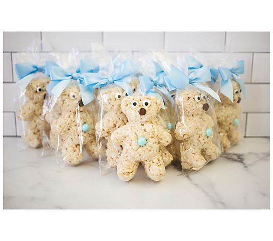 teddy bear treats wrapped in cellophane and tied with blue ribbon on marble countertop