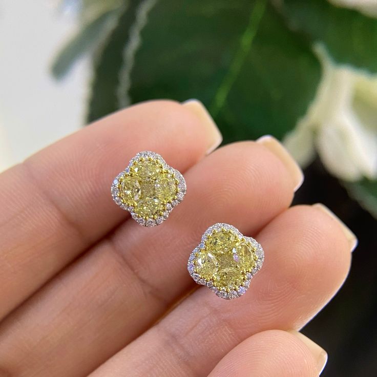 For all of the yellow diamond lovers! This pair of stud earrings contain 1.64 total ct of diamonds . The yellow diamonds are 4 oval shapes surrounding a cushion-cut yellow diamond with the invisible setting, surrounded by yellow gold prongs and white diamonds. The workmanship and quality of these studs make them quite unique. All our jewelry pieces come with an appraisal and replacement value guarantee. Yellow Diamond Earrings With Diamond Accents, Fine Jewelry Yellow Diamond Earrings, Yellow Diamond Earrings In Fine Jewelry Style, Yellow Diamond Earrings For Formal Occasions, Formal Yellow Diamond Earrings, Luxury Yellow Diamond Cut Earrings, Elegant Yellow Diamond Earrings, Yellow Halo Design Earrings In Fine Jewelry, Yellow Halo Design Earrings Fine Jewelry