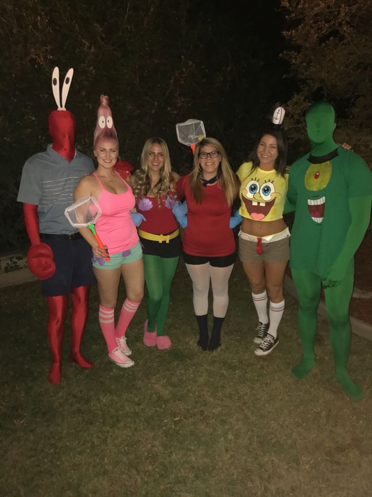 group of people in costumes posing for the camera