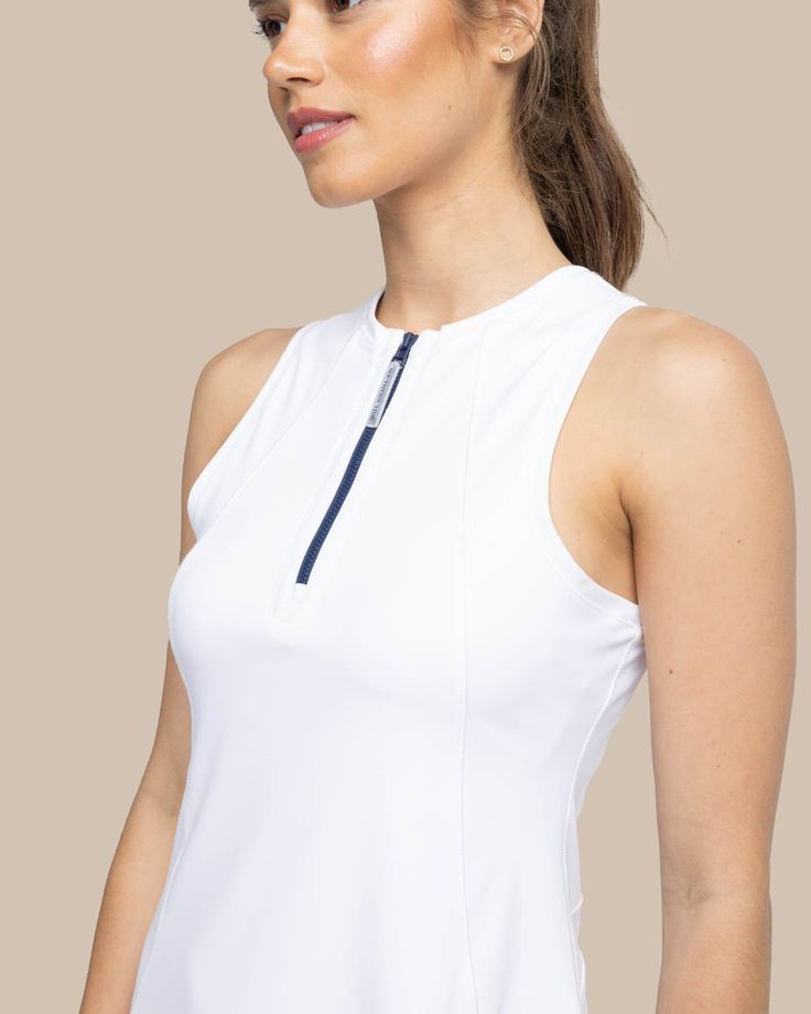 Sophisticated and sporty, our performance dress delivers on form and function from the court to the clubhouse. This sleek sleeveless stunner sports princess seams on stretch fabric at the front and back for a flawless fit. Built from cooling, wicking materials with UV protection, it's built to last through every match. Style: 10748 Fitted Sleeveless Tennis Tops, Fitted Tennis Tops, Elegant Fitted Sleeveless Tennis Dress, Fitted Athleisure Activewear For Golf, White Sleeveless 4-way Stretch Activewear, Fitted Sleeveless Tennis Tank Top, Fitted Sleeveless Tank Top For Tennis, Fitted Racerback Sporty Tennis Dress, Fitted Racerback Tennis Dress For Sports