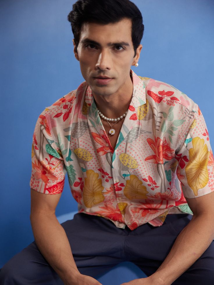 SHVAAS BY VASTRAMAY Men's Multicolor Floral Printed Half Shirt Add a touch of summer to your wardrobe with this multicolor floral printed half shirt from Shvaas by Vastramay. Made from a comfortable cotton blend, this shirt features a relaxed fit, notched collar, and half sleeves. Perfect for casual outings or weekend getaways. Features Multicolor floral print Cotton blend fabric Relaxed fit Notched collar Half sleeves Specifications Material:Cotton Blend Material & Care Care Instructions: Dry c Half Shirt, Care Care, Half Shirts, Notched Collar, Weekend Getaways, Floral Printed, Half Sleeves, Printed Cotton, Care Instructions