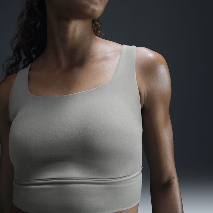 Find your bliss in this medium-support bra. A sewn-in 1-piece pad and longline silhouette offer enhanced coverage and shaping while sweat-wicking technology keeps you cool and comfortable. The fabric in the body and straps is lightweight, with softness that you can feel with every bend, stretch and shift. You might just forget you're wearing a bra at all. Nike Yoga Sports Bra With Built-in Bra, Nike Sports Bra With Built-in Bra For Yoga, Nike Sports Bra With Medium Support And Built-in Padding, Nike Seamless Sports Bra For Athleisure, Nike Seamless Sports Bra For Yoga, Nike Activewear With Built-in Bra For Workout, Nike Sports Bra With Light Support And Compressive Fit, Nike Compressive Sports Bra With Light Support, Nike Yoga Top With Built-in Bra