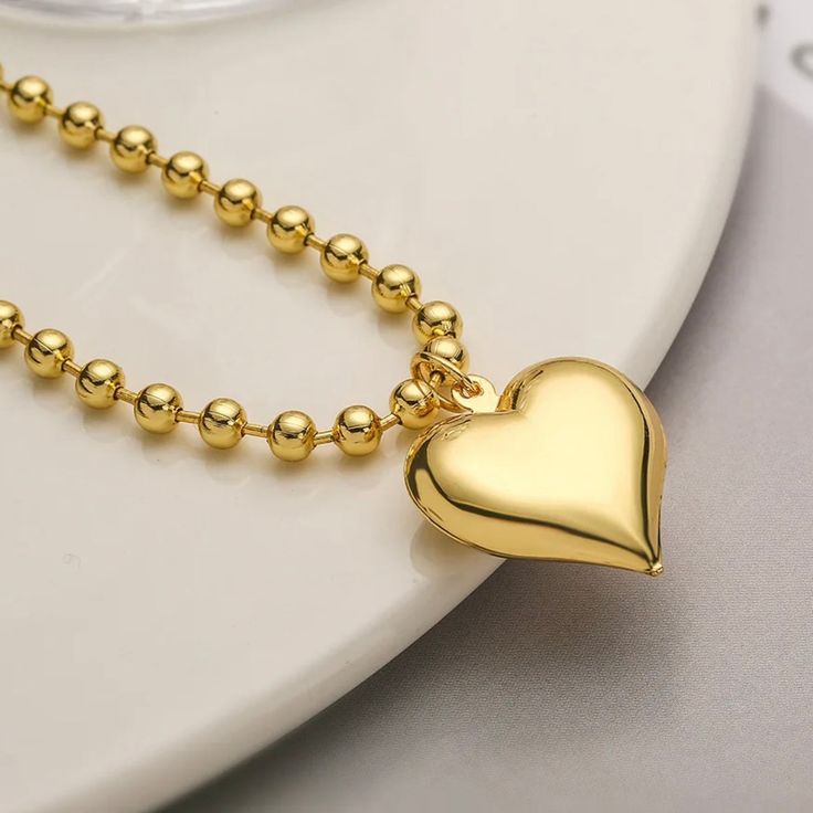 Unleash your bold and radiant style with our 'Max' Large Heart Chain Necklace. Crafted with non-tarnish 18K gold plating and durable stainless steel, this necklace exudes elegance and adds a touch of sophistication to any outfit. Elevate your look with this statement piece that radiates luxury and quality. 18k gold plated stainless steel Non tarnish Pendant Size (inch): 1 x 1 Chain Length (inch): 15 Extension Length (inch): 2 Heart Chain Necklace, Large Heart, Heart Chain, Plus Size Shopping, Elevate Your Look, Earring Necklace, Gold Plating, Chain Lengths, Chain Length