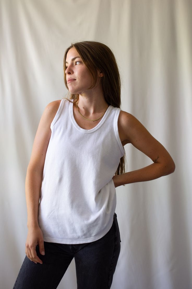 White Seamless Crew Neck Tank Top, Basic Crew Neck Tank Top, Basic Cotton Tank Top With Scoop Back, Seamless Cotton Tops With Scoop Back, Casual Scoop Neck Tops For Everyday, Everyday Fitted White Muscle Tee, White Seamless Top With Scoop Back, White Seamless Tops With Scoop Back, White Seamless Scoop Back Top