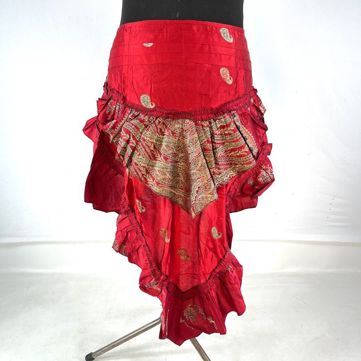 Luna Steampunk Over Skirt, Bustle skirt, tribal mini skirt, fashioned from vintage silk brocade.  This tail skirt is a great addition to all sorts of outfits.  Easily add an extra, colourful layer over leggings, tights, skirts or shorts. Wear at the back or side. The skirt is adjustable in fitting. It has 2 silk ties which are attached to two strong brass hoops for added style and functionality. Strong stitching, pleating and layers of ruched fabric on the tail makes this an eternally stunning p Belly Dance Fitted Skirt For Costume Party, Bohemian Skirt For Cosplay, Fitted Punk Mini Skirt With Ruffles, Gothic Mini Skirt For Festival, Bohemian Fitted Harem Skirt, Fitted Tiered Skirt For Cosplay, Summer Bohemian Skirt For Costume Party, Festival Belly Dance Fitted Skirt, Fitted Mini Skirt For Festival