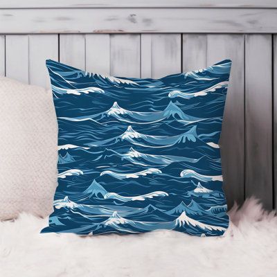 a blue pillow with white waves on it