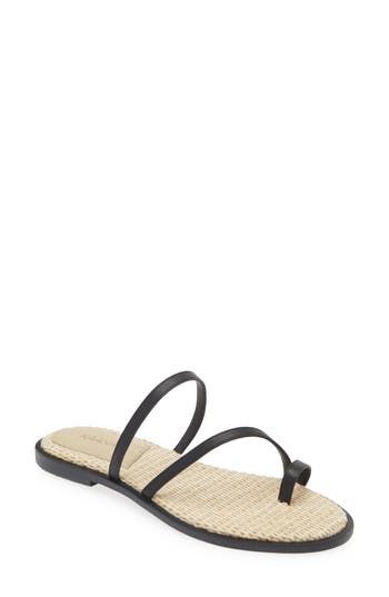 A woven raffia footbed and slender toe loop emphasize the beachy vibe of an easy-wear slide sandal made for sunny days. Synthetic upper/leather lining/synthetic sole Imported Hispanic & Latinx Owned/Founded Beach Black Sandals With Woven Detail, Strappy Sandals With Removable Insole For Vacation, Synthetic Toe Loop Sandals For Vacation, Black Straw Sandals For Beach, Beach Open Toe Synthetic Toe Ring Sandals, Beach Footbed Sandals With Toe Post, Synthetic Open Toe Sandals For Beach, Synthetic Open Toe Ring Sandals For Beach, Summer Toe Loop Sandals For Beach Season