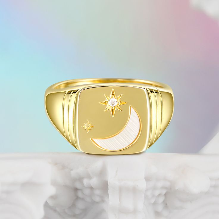 The crescent represents the cycles of life.  New beginnings will flourish for you always--wear this ring a reminder of the cyclical nature of the universe. Shine bright like the sparkling midnight sky! Let this moon and star signet ring speak to your soul, with its gorgeous moon hand set in a signet ring accompanied by a delicate dusting of stars.Carat Weight: 0.019 ctStone Size: 1.3 mmStone Type: Jeulia® StoneNumber of Stones: 1 Stone Shape: RoundStone Color: Diamond WhiteWeight: 4.8 gWidth: 3. Celestial Gold Crescent Rings, Celestial Crescent Gold Rings, Celestial Open Ring With Moon Phase Detail, Celestial Crescent Yellow Gold Rings, Celestial Moon Phase Open Ring Jewelry, Magical Moon Shaped Ring With Moon Phase Detail, Magical Moon-shaped Ring With Moon Phase Details, Magical Moon Shaped Ring With Moon Phase, Magical Moon-shaped Ring With Moon Phase