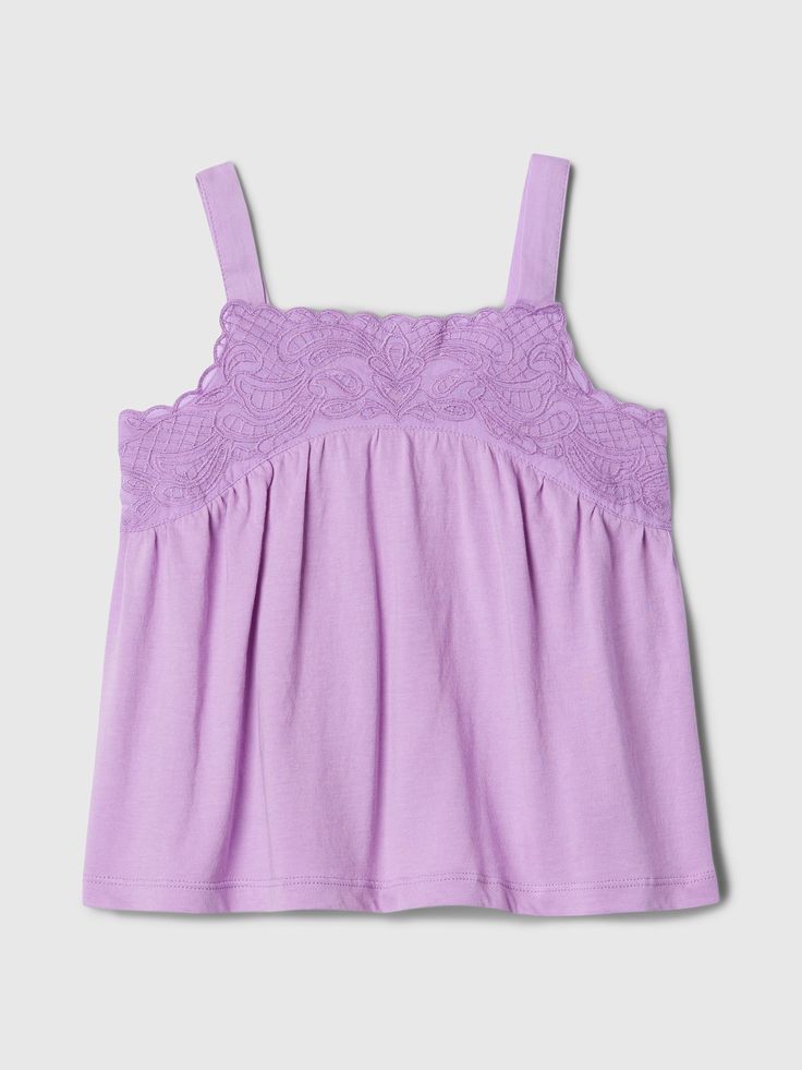 Soft cotton tank top.  Square neck.  Tank straps.  Lace detailing at chest.  Straight, easy fit.  Hits at the hip.  Sizes range from baby to toddler. Gap Seamless Summer Tops, Cotton Tank Top With Lace Trim, Fitted Cami Tops By Gap, Gap Seamless Tank Top For Summer, Spring Cotton Tank Top By Gap, Gap Cotton Tank Top For Summer, Gap Summer Tank Top, Cotton Tank Top With Lace Trim And Spaghetti Straps, Gap Summer Cami Tank Top