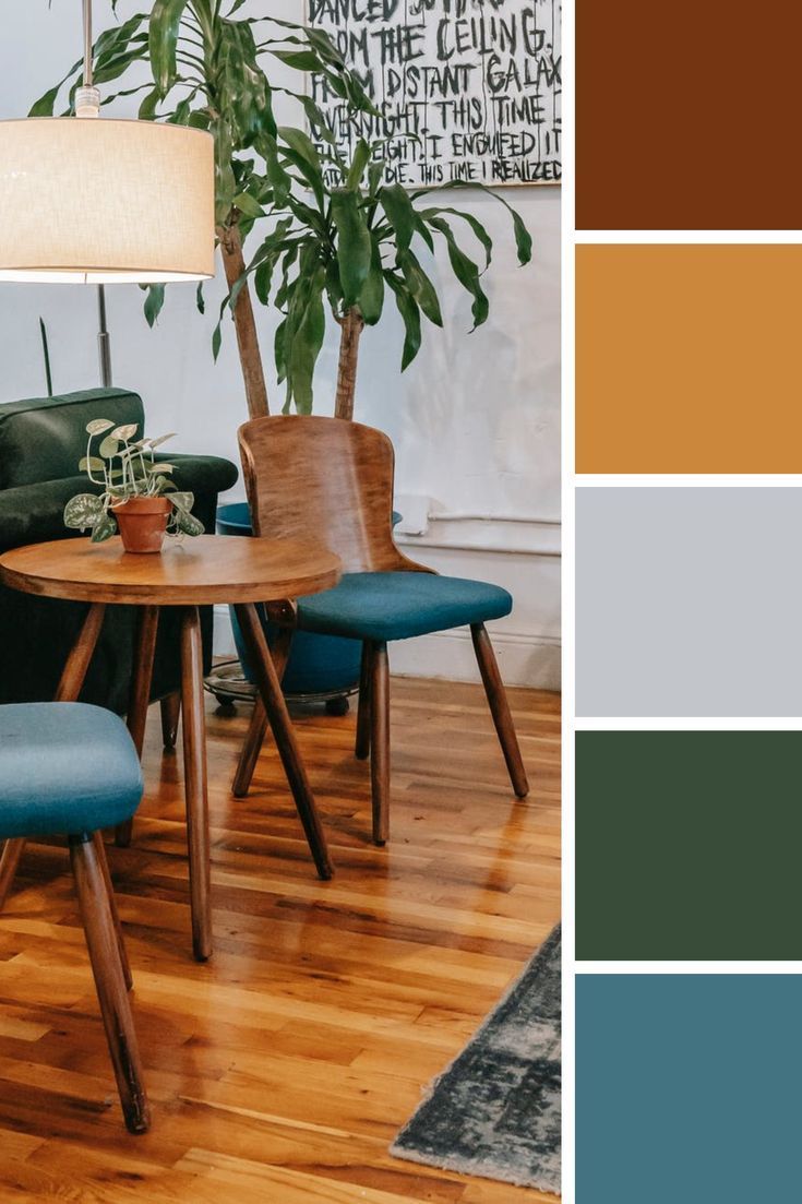 a living room with wood floors and blue chairs