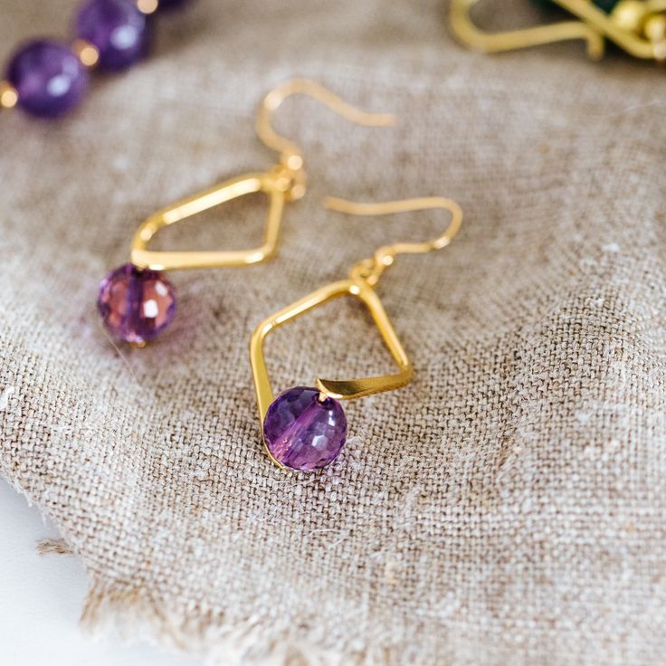 Faceted Amethyst Dangle Earrings - T. Randall Jewelry Diamond-shaped Earrings With Ear Wire For Gifts, Nickel-free Diamond-shaped Jewelry For Gifts, Nickel-free Diamond-shaped Jewelry Gift, Gift Diamond-shaped Earrings With Ear Wire, Gold Diamond-shaped Jewelry With Matching Earrings, Teardrop Earrings With Faceted Beads For Gifts, Faceted 14k Gold Filled Yellow Gold Earrings, Handmade Elegant Diamond-shaped Jewelry, Faceted Beads Briolette Earrings For Gift