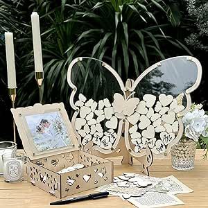 a wooden table topped with a butterfly shaped mirror next to candles and other items on top of it