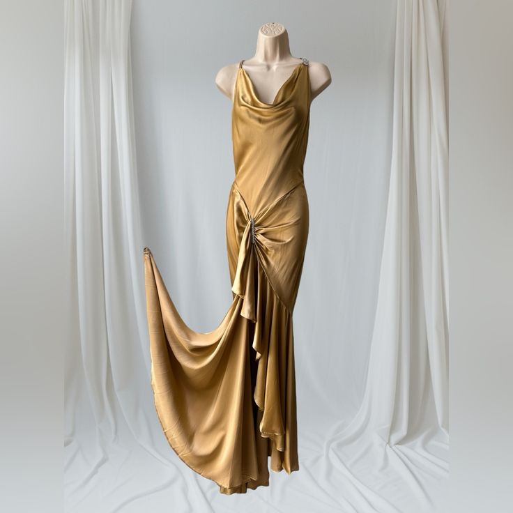 Worn Once. 2000s Era. Yolanda Arche Collection, Size S, Gold Silk Satin, Made In Usa Stunning Gown! Show Your Beautiful Figure! Draped Neck And Back Tons Of Fabric In Folds Of The Hem Open Back Spaghetti Straps Rhinestone Straps Rhinestone Front Detail A Ring To Wear On Your Finger To Hold A Hem Corner There Are A Few Pics Of Slight Imperfections On The Fabric- They Are Very Insignificant And Barely Noticeable. The Gown Will Be Shipped In A Box Under 2 Lb. 30’s Fashion, Open Back Gown, 2000s Era, Long Gowns, Draping Fashion, Beautiful Figure, Silk Gown, Stunning Gowns, Gold Silk