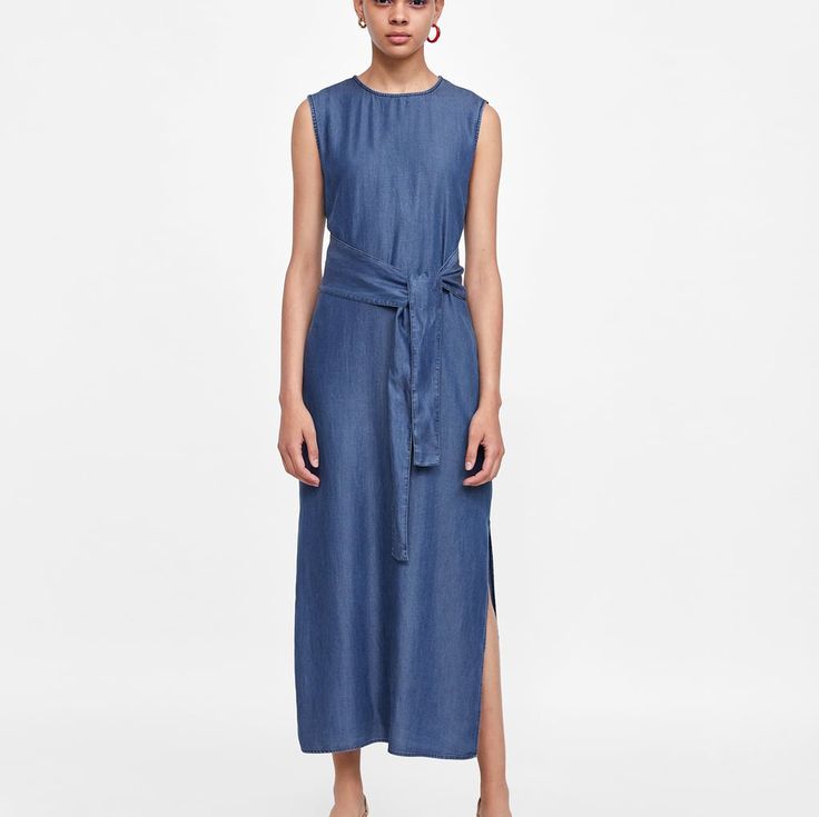 Flowing Sleeveless Dress With A Round Neckline And Elastic Waist. Features A Matching Tied Belt At The Waist, Side Slipt At The Hem, And The Button Opening In The Back. Outer Shell 100% Lyocell Casual Blue Dresses With Tie Fastening, Casual Blue Dress With Tie Fastening, Sleeveless Midi Dress With Tie Fastening, Blue Dress With Tie Fastening For Summer, Sleeveless Midi Sundress With Tie Waist, Chic Sleeveless Maxi Dress With Tie Fastening, Spring Sleeveless Midi Dress With Tie Waist, Sleeveless Midi Dress With Tie Fastening For Summer, Blue Daywear Dress With Tie Fastening