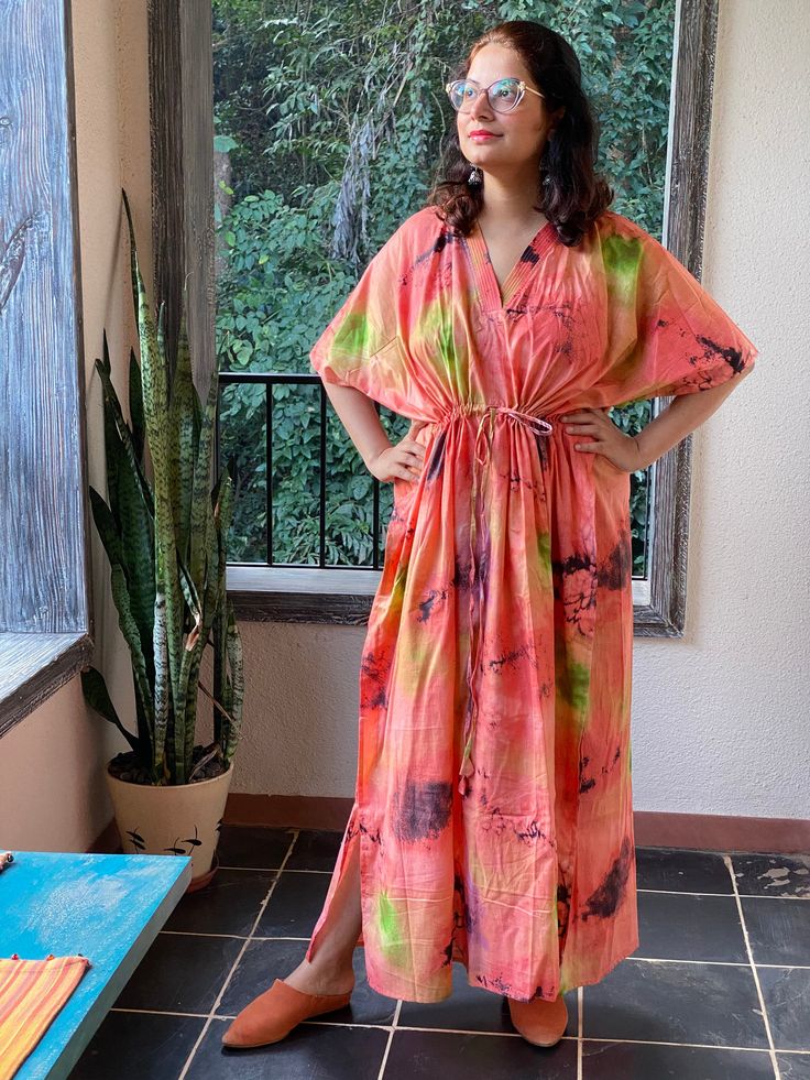 I made this caftan dress from a beautiful watercolor pattern and is available in many colors. I used the softest mulmul cotton fabric to make this. It is extremely soft and it gets softer with every wash. It is so free flowing, that it will make you feel as if you aren't wearing anything at all ;) The beauty of the Kaftans is they will fit everyone so no need to worry about the size et all. All my Kaftans have deep necks(11-12 inches) so will fit all head sizes. However, the length of my kaftans Colorful Short Sleeve Maxi Dress For Beach, Multicolor Batik Print Kimono For The Beach, Vibrant Short Sleeve Maxi Dress For Beach, Vibrant Short Sleeve Maxi Dress For The Beach, Vibrant Short Sleeve Maxi Dress For Vacation, Vibrant Short Sleeve Beach Maxi Dress, Multicolor Printed Dresses For Loungewear, Printed Multicolor Dresses For Loungewear, Multicolor V-neck Kaftan For Loungewear