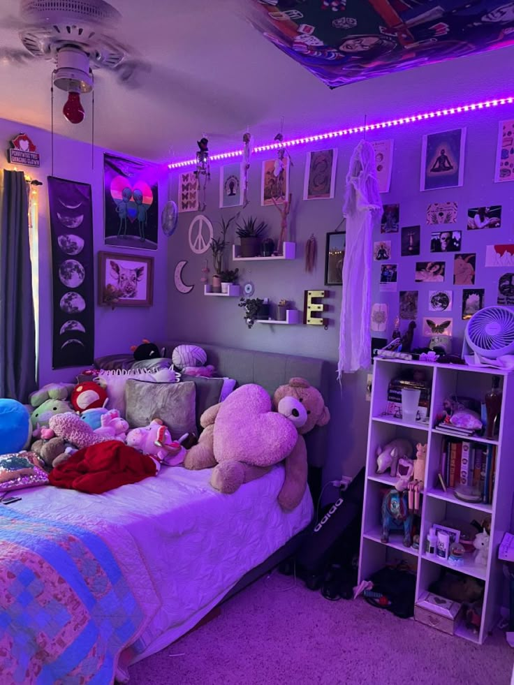 a bedroom with purple lighting and stuffed animals on the bed