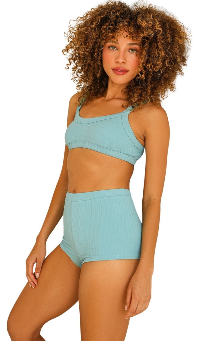 The KELLY TOP is the perfect way to stay chill and stylish when you hit the beach. This bikini top's comfortable design will keep you feeling great as you soak up those rays! Look hot and stay cool with the KELLY TOP! 87% Nylon 13% Spandex Imported from Vietnam Wide adjustable straps All around bandeau style Cropped Swimwear With Built-in Bra For Vacation, Summer Beachwear Crop Top With Built-in Bra, Stretch Crop Top With Built-in Bra For Beach, Beachwear Crop Top With Built-in Bra For Beach, Summer Bandeau Top With Seamless Construction, Beachwear Cropped Crop Top For Beach Season, Seamless Summer Bandeau Top, Blue Seamless Swimwear For Summer, Casual Triangle Top Swimwear For Lounging