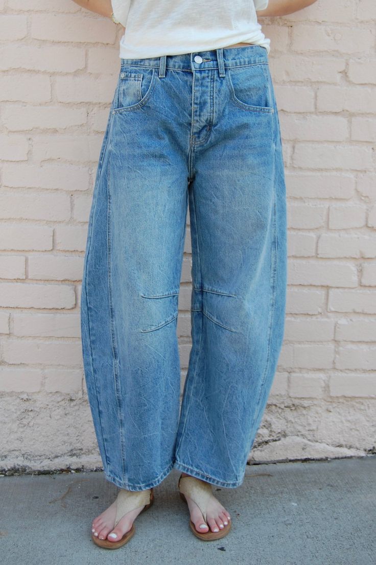 Bellamy Barrel Jeans in Denim ♡ Product Highlights ♡ These Bellamy Barrel Jeans in Denim are the perfect stylish staple piece to add to your closet, and or any on-trend bohemian style outfit! Featuring a 5 pocket styling, a lined knee and side leg detail and a medium wash denim blue color, this jean is perfect for any boho look! ✁ Contents & Measurements ✁ These Bellamy Barrel Jeans in Denim's contents contain 100% Cotton material. • 5 pocket styling • Button & zipper fly closure • Total body le Stonewashed Denim Blue Jeans For Fall, Stonewashed Denim Jeans For Fall, Trendy Washed Blue Cargo Jeans For Fall, Trendy Fall Washed Blue Cargo Jeans, Stonewashed Jeans For Fall, Fall Stonewashed Denim Blue Jeans, Bohemian Baggy Jeans For Spring, Dark Wash Stonewashed Jeans For Fall, Stonewashed Relaxed Fit Jeans For Spring