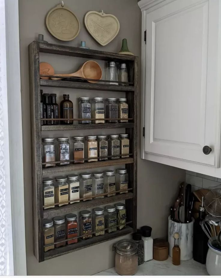 an old spice rack in the corner of a kitchen