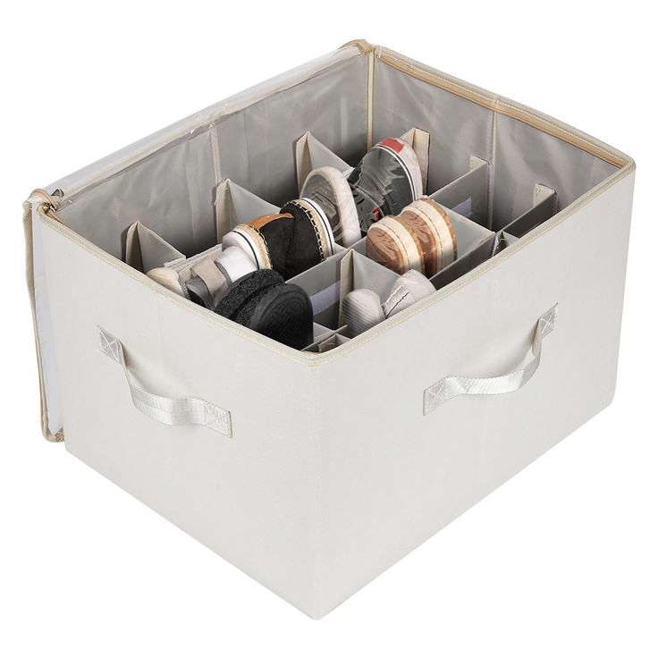 a white storage box filled with different types of thread