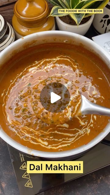 a pot filled with soup sitting on top of a table