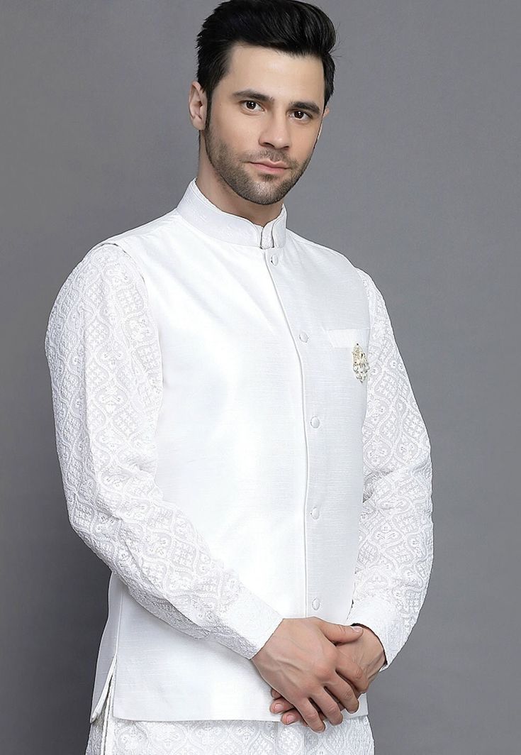 Art Silk Nehru Jacket in WhiteThis Readymade Sleeveless attire is Enhanced with Buttons. Crafted in Chinese Collar NeckDo note: Brooch and Kurta shown in the image is for presentation purposes only. Half to one inch may vary in measurement. (Slight variation in actual color vs. image is possible) Mens Kurta | Mens Kurta Pajama | Mens Sherwani | Mens Sherwani Sets | Traditional Menswear | Partywear Menswear | Indian Mens Dresses | Diwali Kurta | Kurta Pajama | Bollywood Menswear | Mens Nehru Jack Luxury Off-white Nehru Jacket For Men, White Sleeveless Nehru Jacket For Festive Occasions, Sleeveless White Nehru Jacket For Festive Occasions, Festive White Sleeveless Nehru Jacket, White Embroidered Sleeveless Nehru Jacket, White Nehru Jacket With Stand Collar For Festive Occasions, White Nehru Jacket With Stand Collar For Formal Occasions, White Festive Nehru Jacket With Stand Collar, Festive White Nehru Jacket With Stand Collar