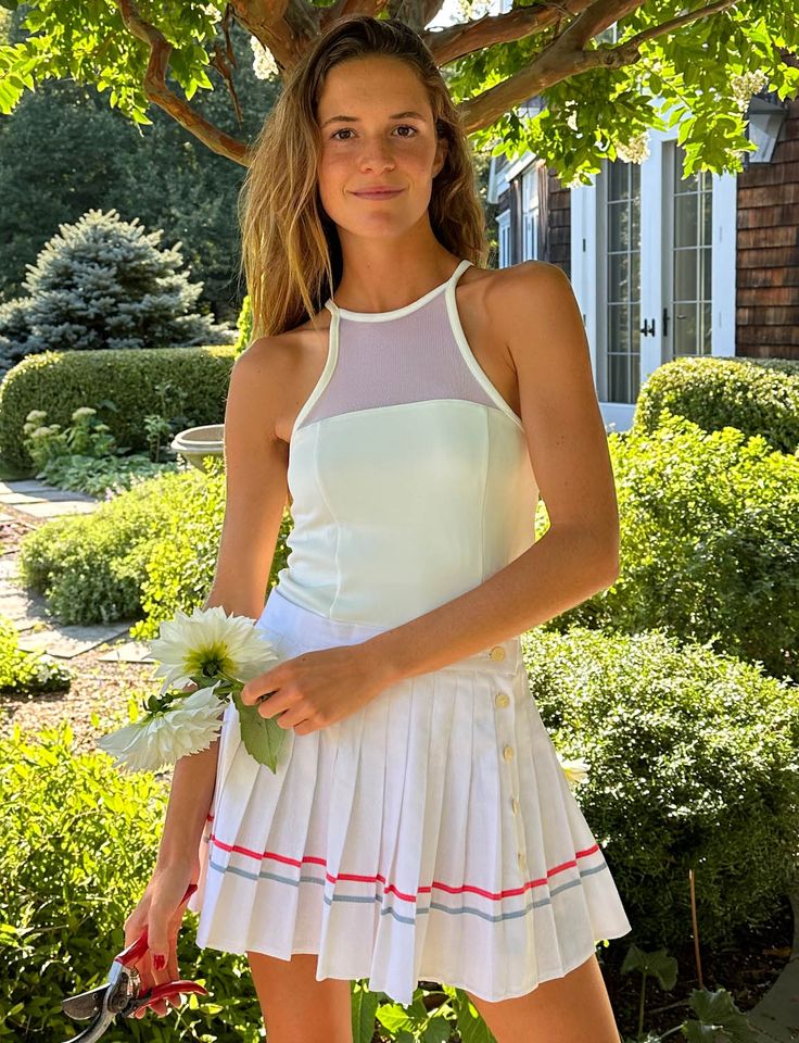 Capture classic court vibes with the Vintage White Tennis Lacoste Skirt. This piece exudes a timeless aura, boasting a white canvas accented by delicate blue and pink lining. The skirt brings a touch of nostalgia to your tennis style, making every swing a tribute to the sport's heritage. Discovered at a vintage market in Paris. CONDITION: perfect Vintage product is for sale in USA only. Elegant Fitted Tennis Skirt For Spring, Classic Lined Tennis Skirt For Summer, Chic Spring Tennis Dress For Day Out, Chic Fitted Tennis Skirt For Spring, Classic Stretch Tennis Skirt For Summer, White Fitted Tennis Skirt With Contrast Trim, Classic Fitted Tennis Dress For Spring, Fitted White Tennis Skirt With Contrast Trim, White Tennis Skirt For Summer