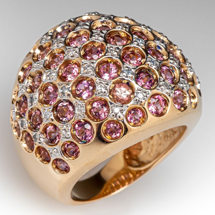 This beautiful dome ring features sixty-five (65) round modified brilliant cut pink tourmaline in recessed bead settings. The tourmalines are accented with thirty-six (36) bead set, round single cut diamonds. The ring measures 22.5mm at the top, rises 8.9mm above the finger, tapering to 4.4mm wide and 0.7mm thick at the base of the shank. It is currently a size 7.25. Heart Cut Engagement Ring, Tourmaline Rings, Stackable Engagement Ring, Cushion Cut Engagement, Show Beauty, Stackable Wedding Bands, Sterling Silver Wedding Band, Cushion Cut Engagement Ring, Silver Wedding Bands