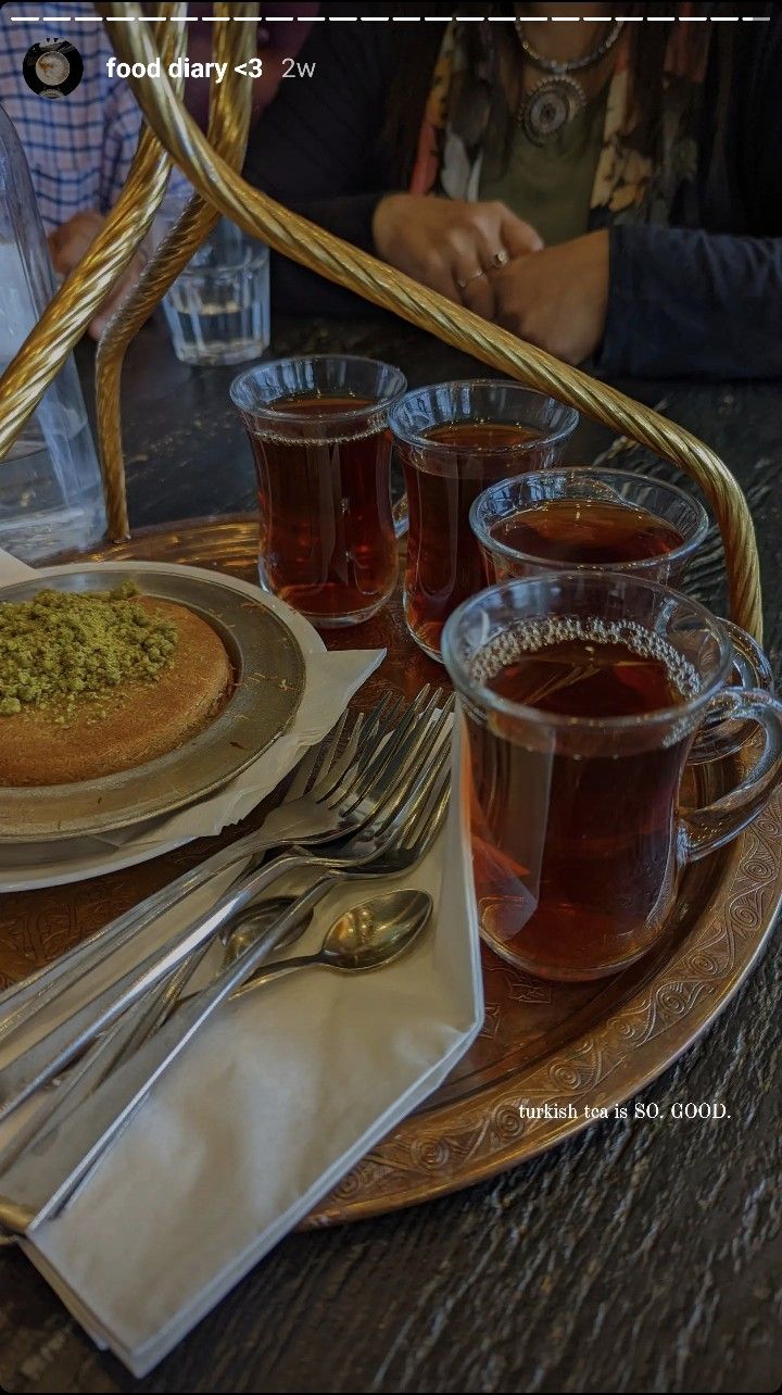 there is a tray with tea and silverware on it