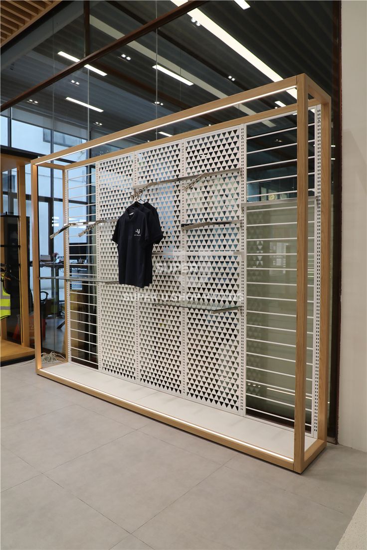 an open display case with clothes on it