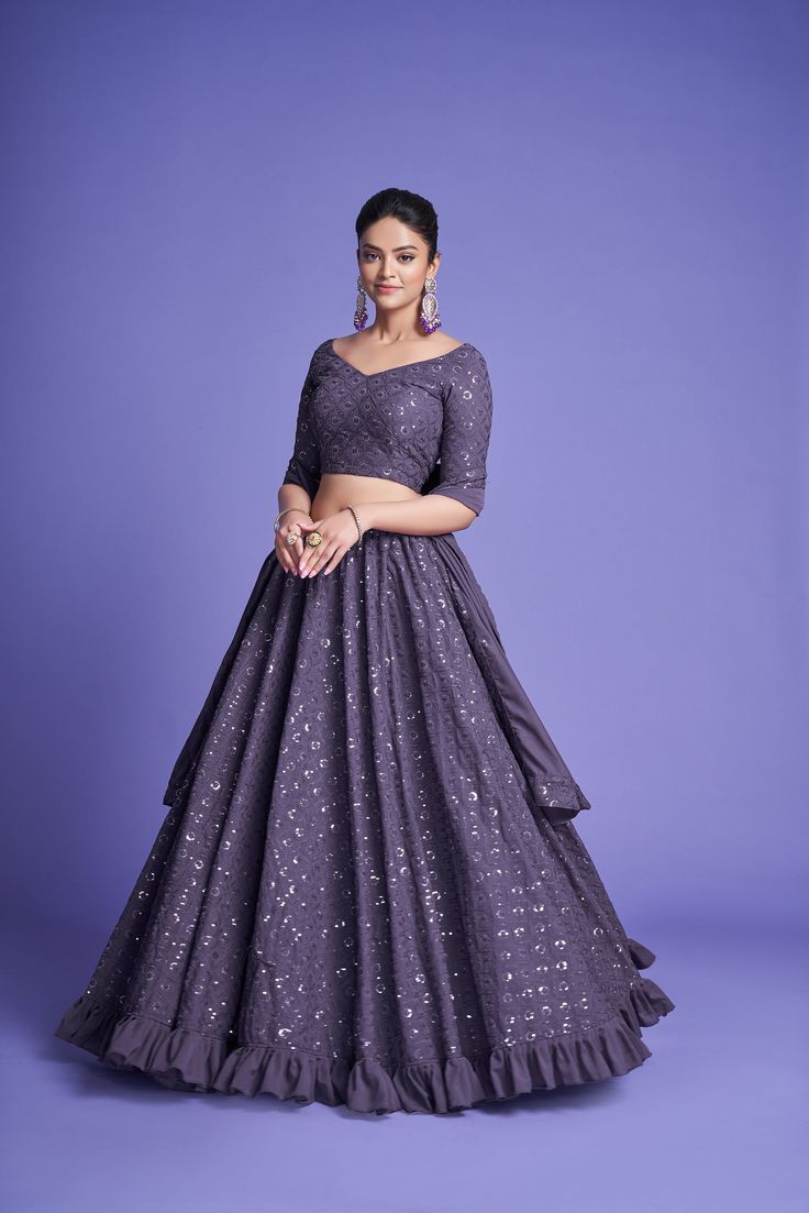 Make a statement in this 3-piece Mauve Purple Diamond Georgette Thread & Sequins Embroidered Lehenga Choli Set, featuring a floor-length lehenga with 4 meters of flair, a Sweetheart Neck blouse, and a 2.30-meter Dupatta. The no-fuss outfit comes semi-stitched with a standard cancan and canvas attached; plus, customizations are available upon request. Dry Clean only and rock on, fashionista! No of Set - 3-piece set Color- Mauve Purple Blouse Fabric - Diamond Georgette Blouse Sleeves-Regular Sleev Purple Lehenga, Blue Lehenga, Embroidered Lehenga, Mauve Purple, Georgette Blouse, Purple Diamond, Lehenga Saree, Designer Lehenga Choli, Sharara Set