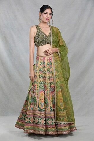 Multi color banarasi silk lehenga with all over Royal mahal woven details. Paired with a sleeveless V neck forest green blouse with floral embroidery using sequin, cutdana highlights and an organza dupatta with sequin work. - Aza Fashions Traditional Chanderi Lehenga, Silk Lehenga With Pallu, Traditional Sleeveless Chanderi Lehenga, Sleeveless Silk Lehenga With Dupatta, Transitional Green Silk Lehenga, Transitional Season Green Silk Lehenga, Transitional Green Silk Choli, Art Silk Choli With Meenakari Detailing, Art Silk Meenakari Choli