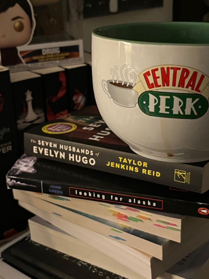 stack of books with coffee mug on top