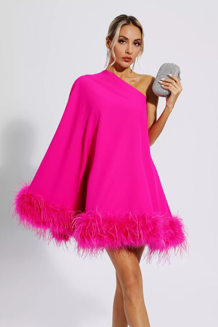 Add cuteness and elegance to your wardrobe with the Ailani Pink Feather Trim One Shoulder Mini Dress! The one-shoulder style design with long sleeves adds a sense of fashion and luxury. The skirt is dotted with feathers, which look fluffy and adorable. Wear heels or boots to create a look that's unique to you. Perfect for cocktails or parties.  Dress Length: Approx 90cm Materials: 70% Polyester, 30% Cotton Gentle Dry Clean Only  Model is 5 ft 7 and wears size S  Colour may vary due to lighting o Glitter Wedding Dress, One Sleeve Dress, Bandage Midi Dress, Feather Trim, Estilo Chic, Pink Feathers, Feather Dress, Puff Sleeve Dresses, Cape Dress