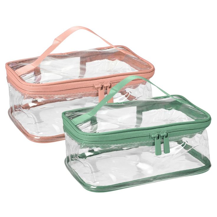 two clear cosmetic bags with green handles on each side and one in the middle, both empty