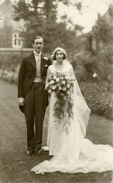 an old black and white photo of a bride and groom