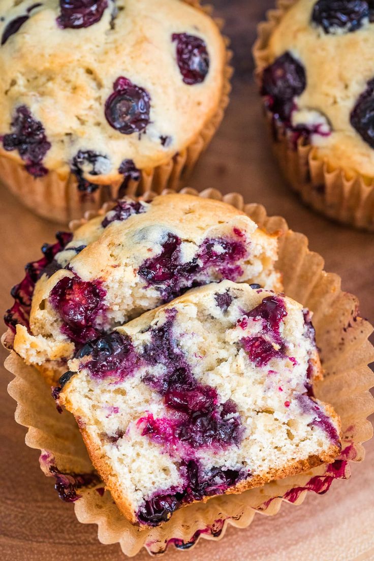 blueberry muffins cut in half on a cutting board